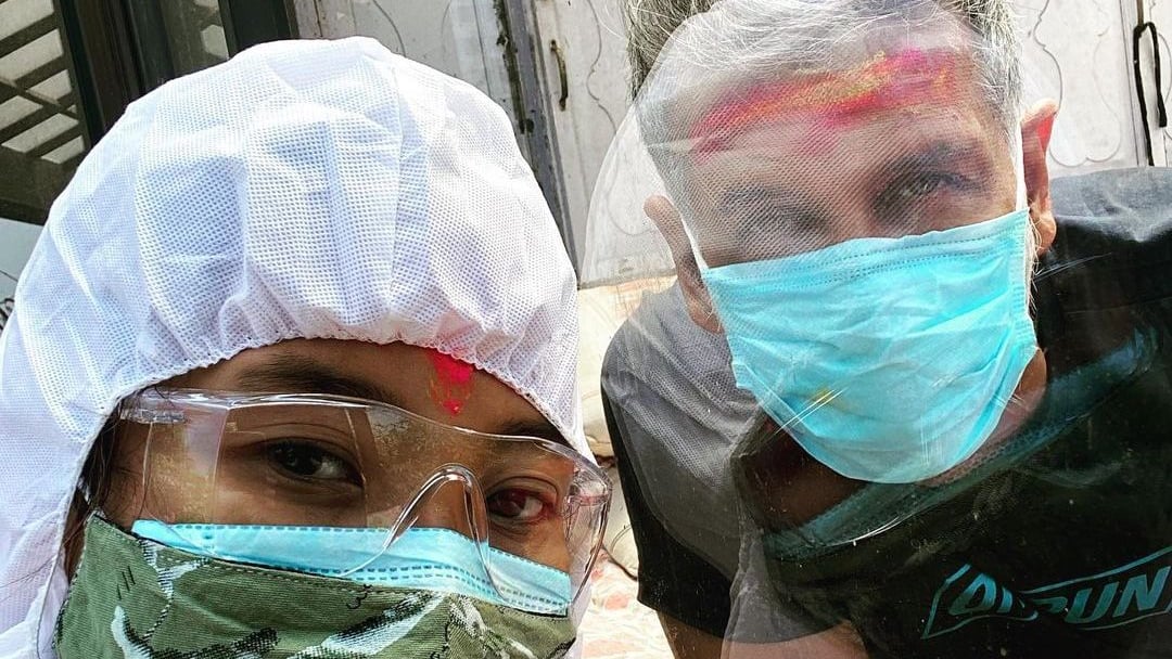 Ankita Konwar puts on a PPE suit to celebrate Holi with Covid-19 positive Milind Soman