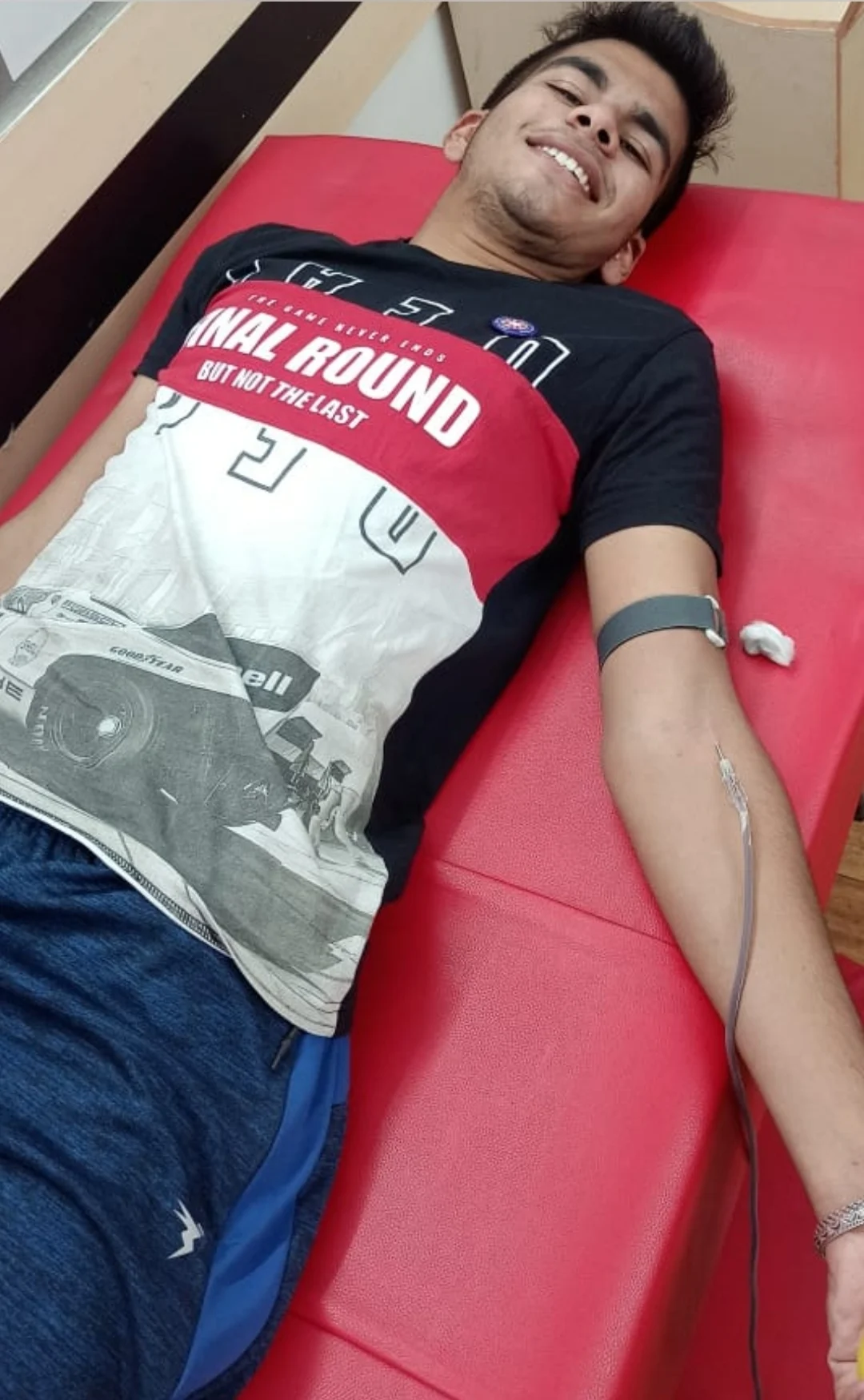 A boy student donates blood