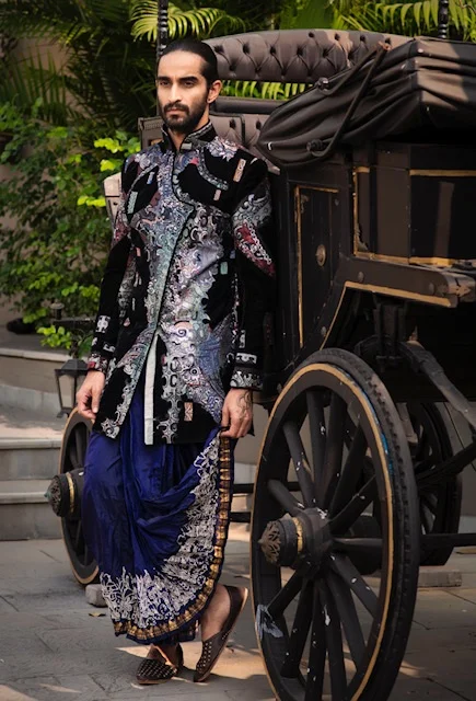 A classic indigo coloured dhoti paired with black jacket