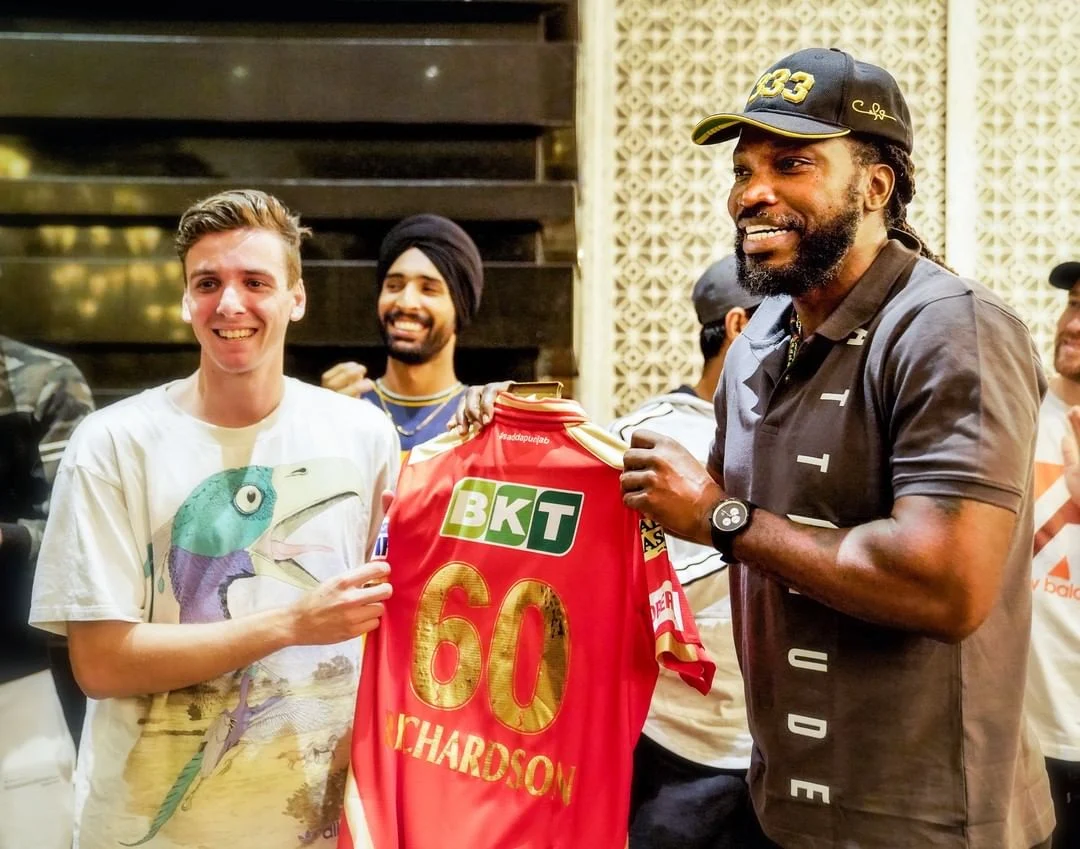 Universe Boss Chris Gayle gives the Punjab Kings'Jersey to PBKS most expensive player Jhye Richardson