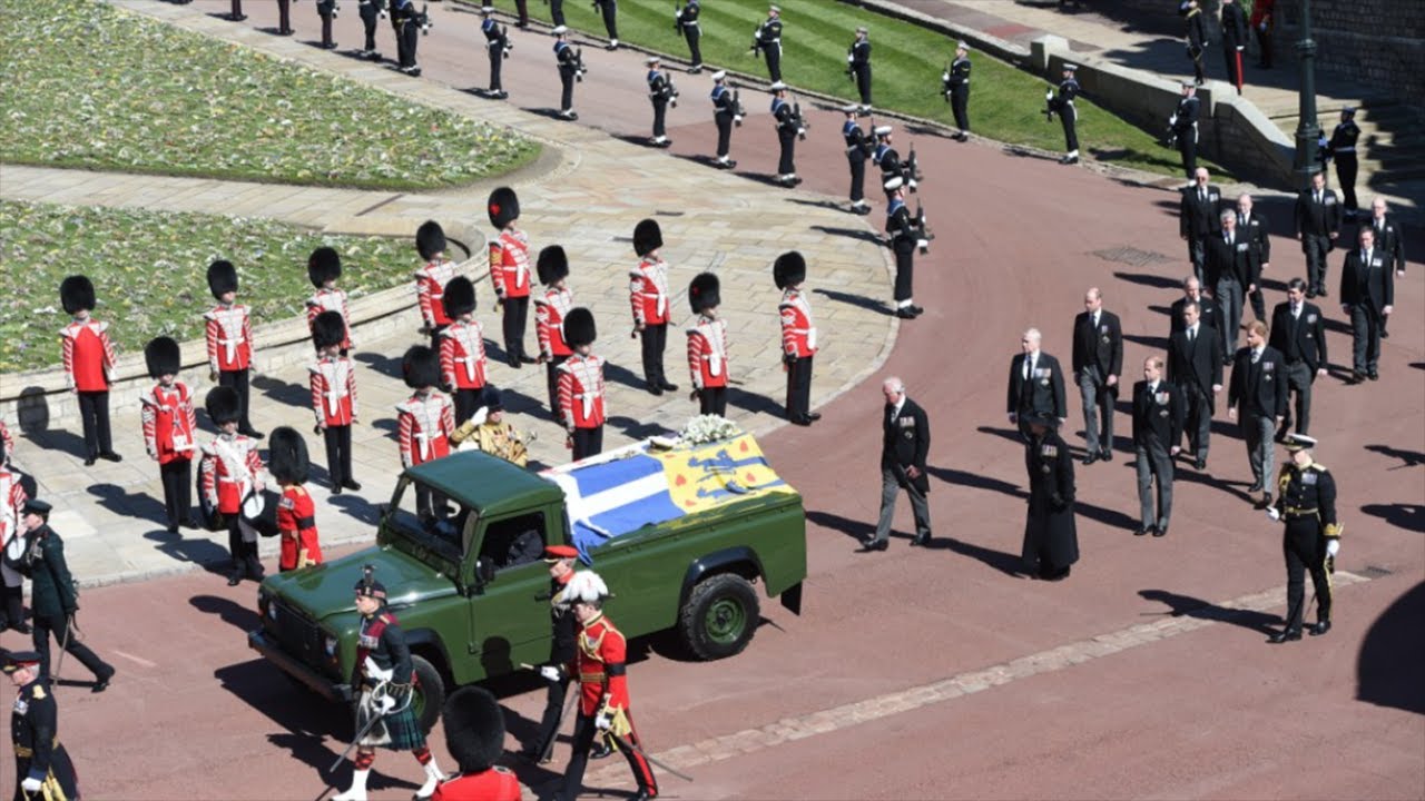 Members of the 1st Battalion Grenadier Guards place the coffin of Britain's Prince Philip onto a modified Jaguar Land Rover in the Quadrangle at Windsor Castle in Windsor, England