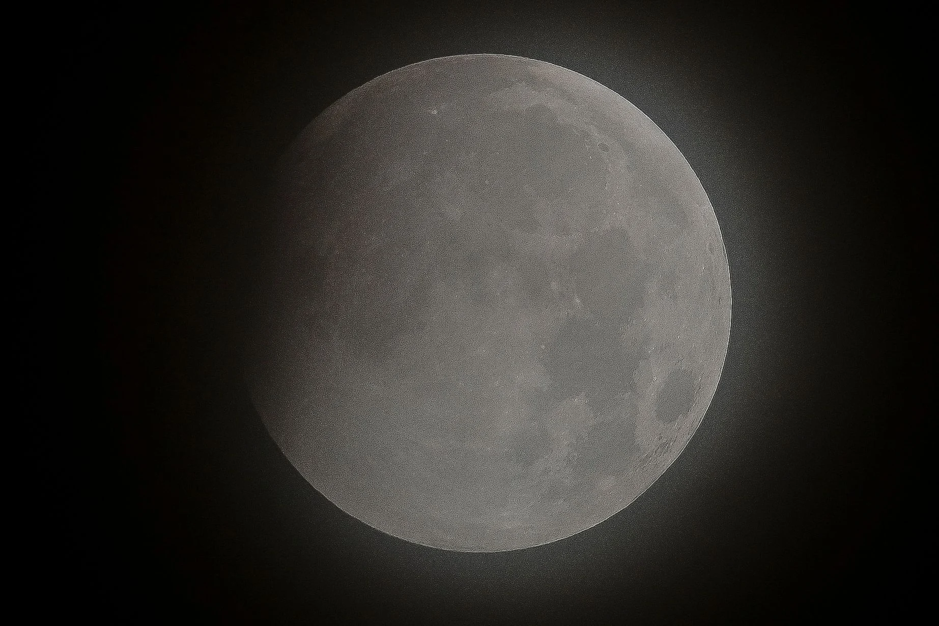 The full moon is seen during the partial eclipse in Mexico City on May 26, 2021 as stargazers across the Pacific are casting their eyes skyward to witness a rare "Super Blood Moon".