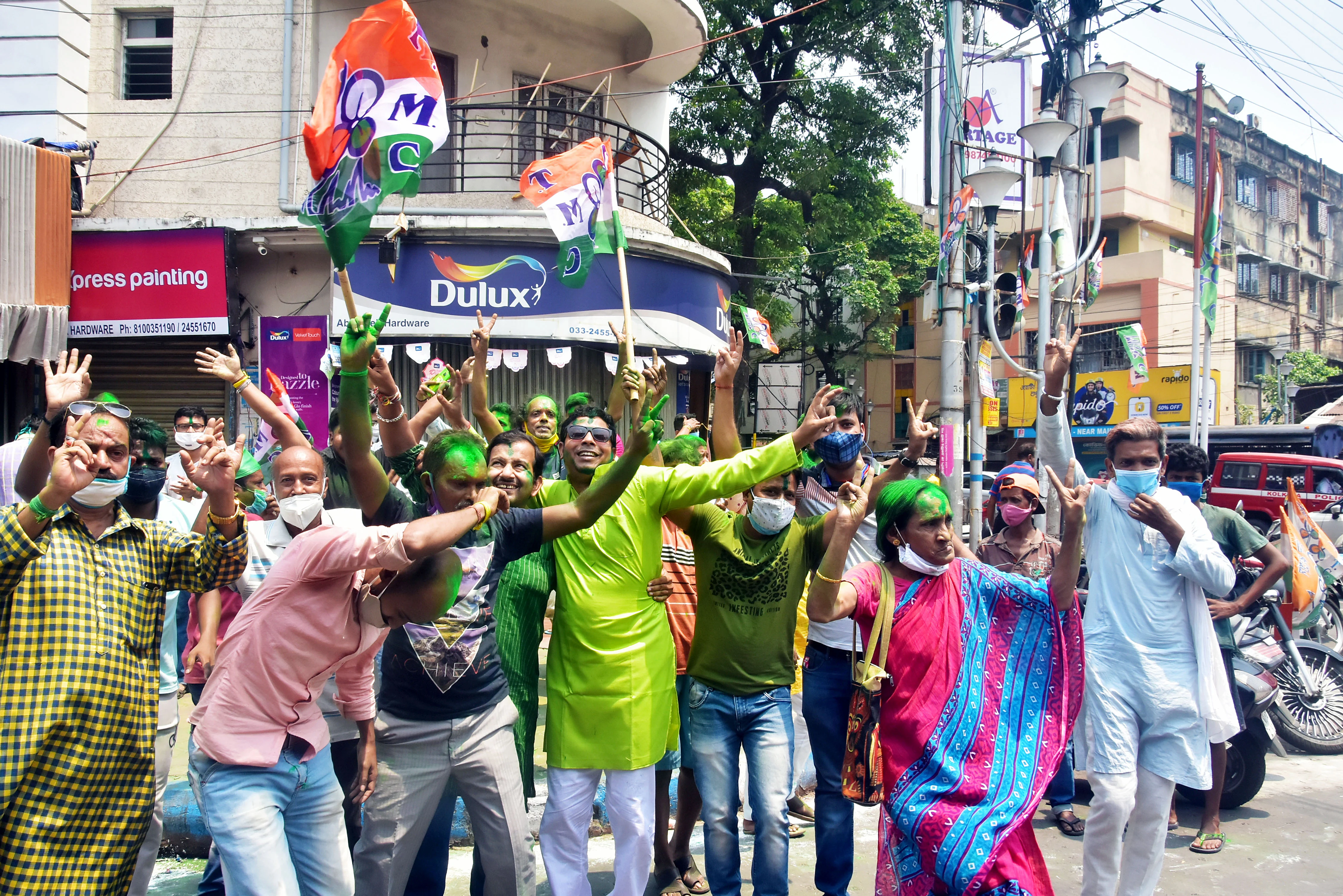 TMC supporters celebrate the party's victory in West Bengal assembly election in front of West Bengal CM Mamata Banerjee's residence, in Kolkata on Sunday.