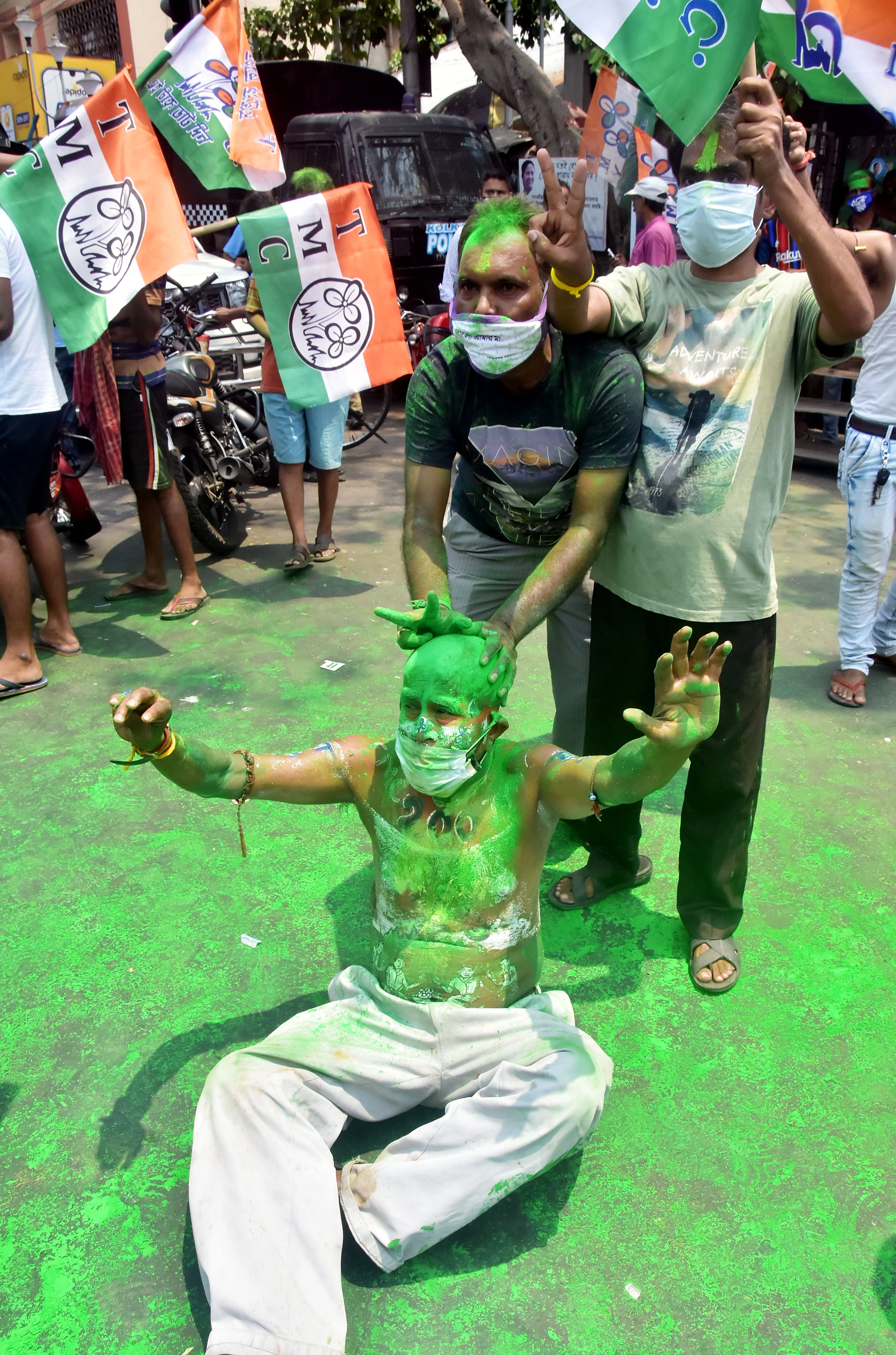 TMC supporters celebrate the party's victory in West Bengal assembly election in front of West Bengal CM Mamata Banerjee's residence, in Kolkata on Sunday.