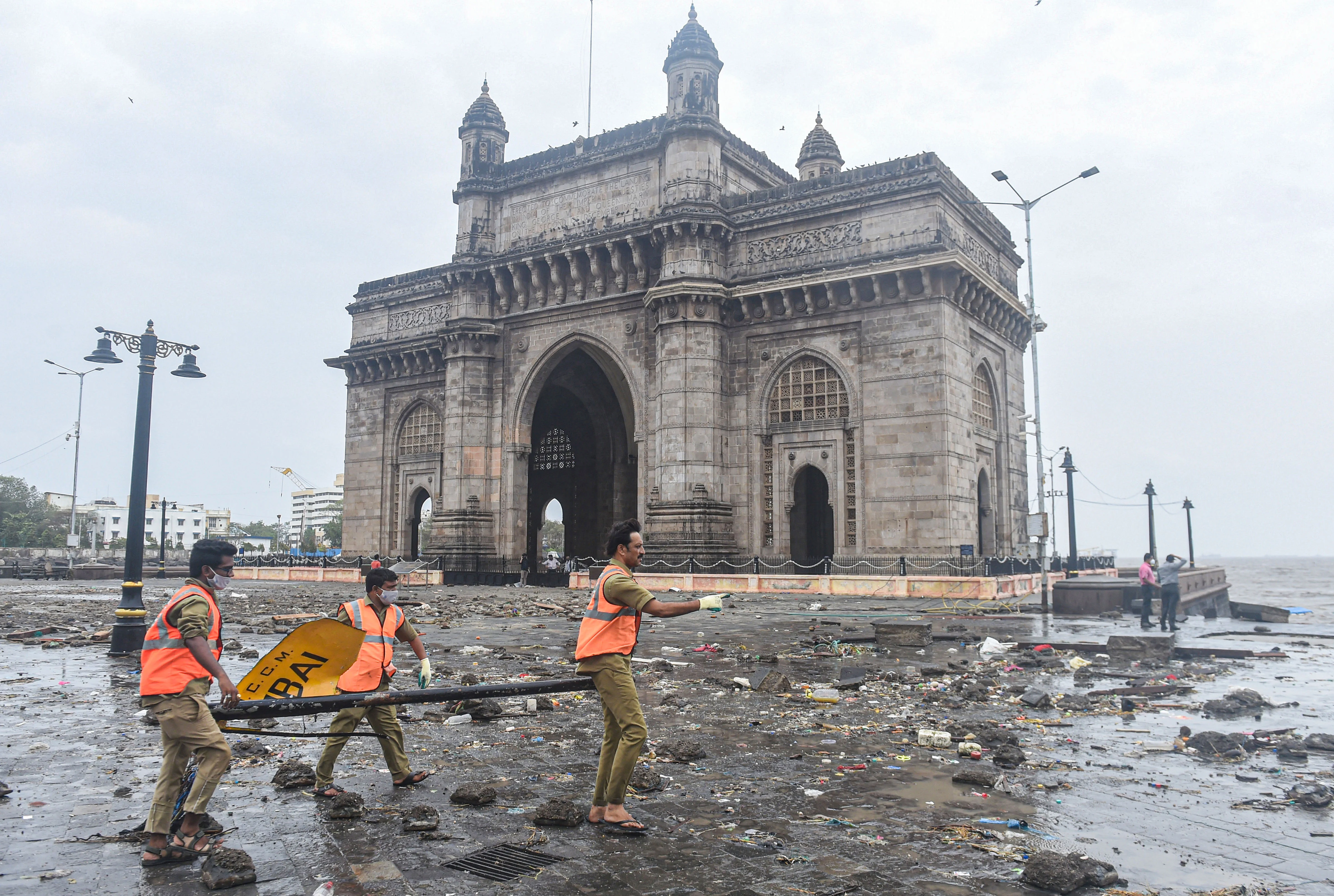 Restoration works underway at the Gateway of India in the aftermath of Cyclone Tauktae, in Mumbai, Tuesday