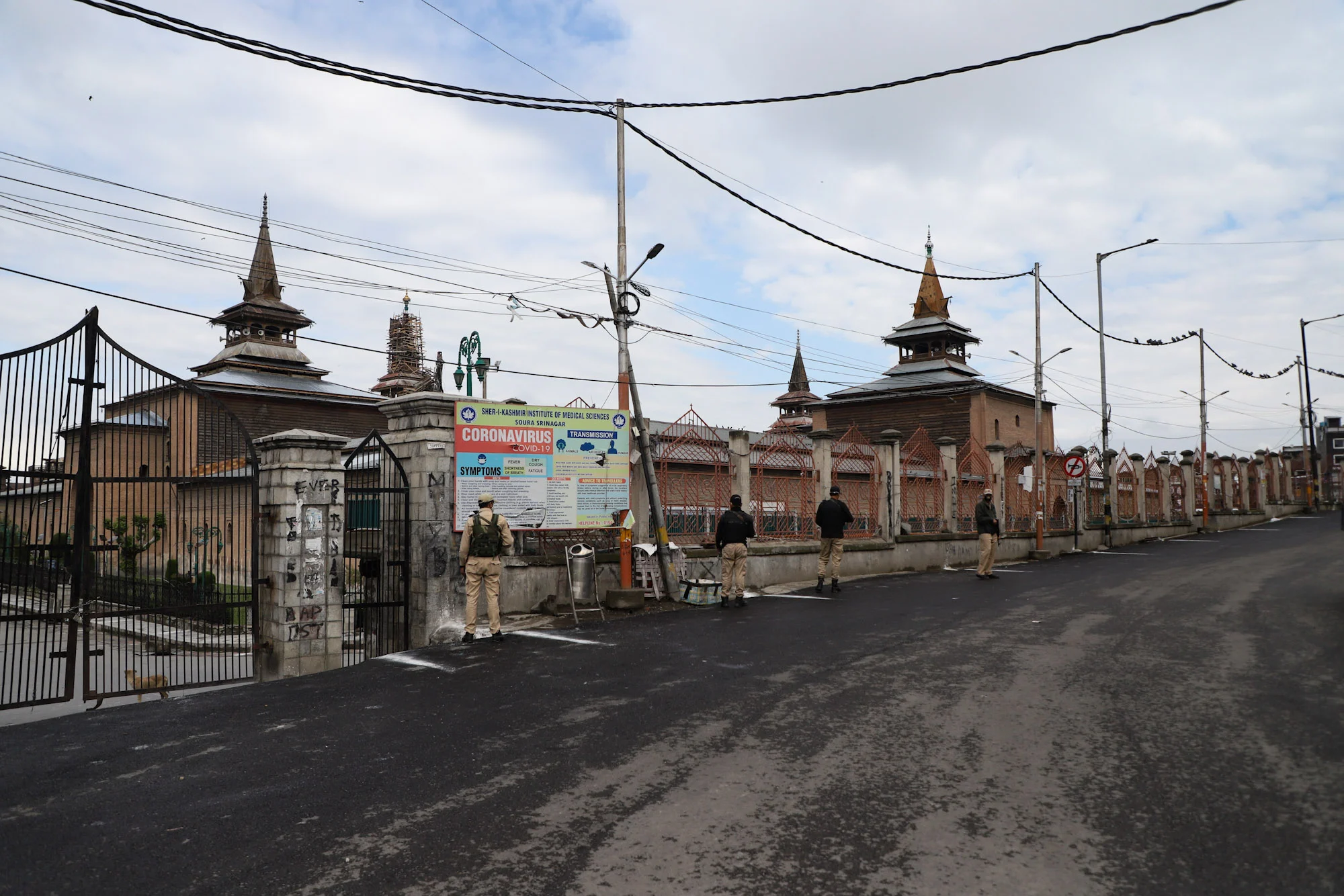 Security personnel stand guard outside the Jama mosque in Srinagar on the day of the Muslim festival of Eid ul-Fitr as strict curfew has been imposed amid concerns over the spread of Coronavirus.