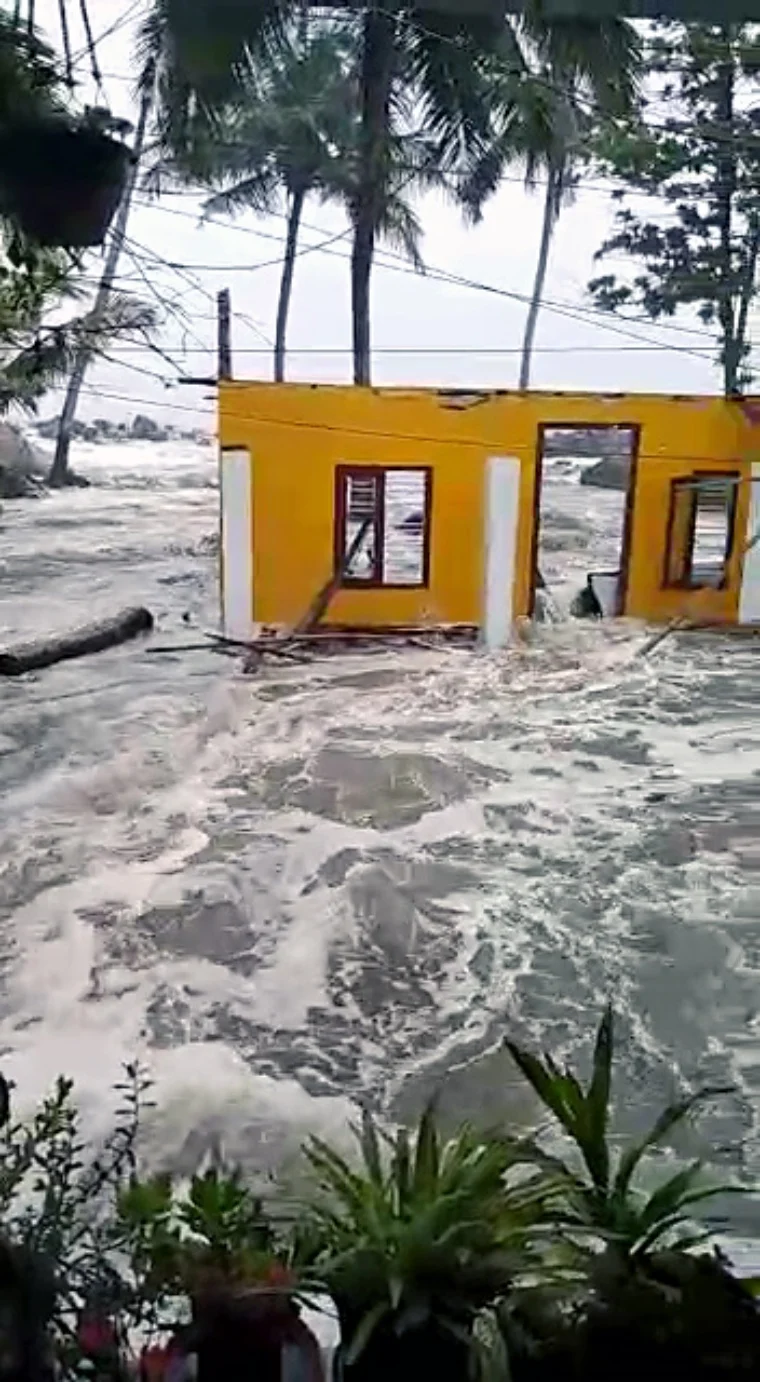 House getting sweeped away in the wayer logged due to heavy rains