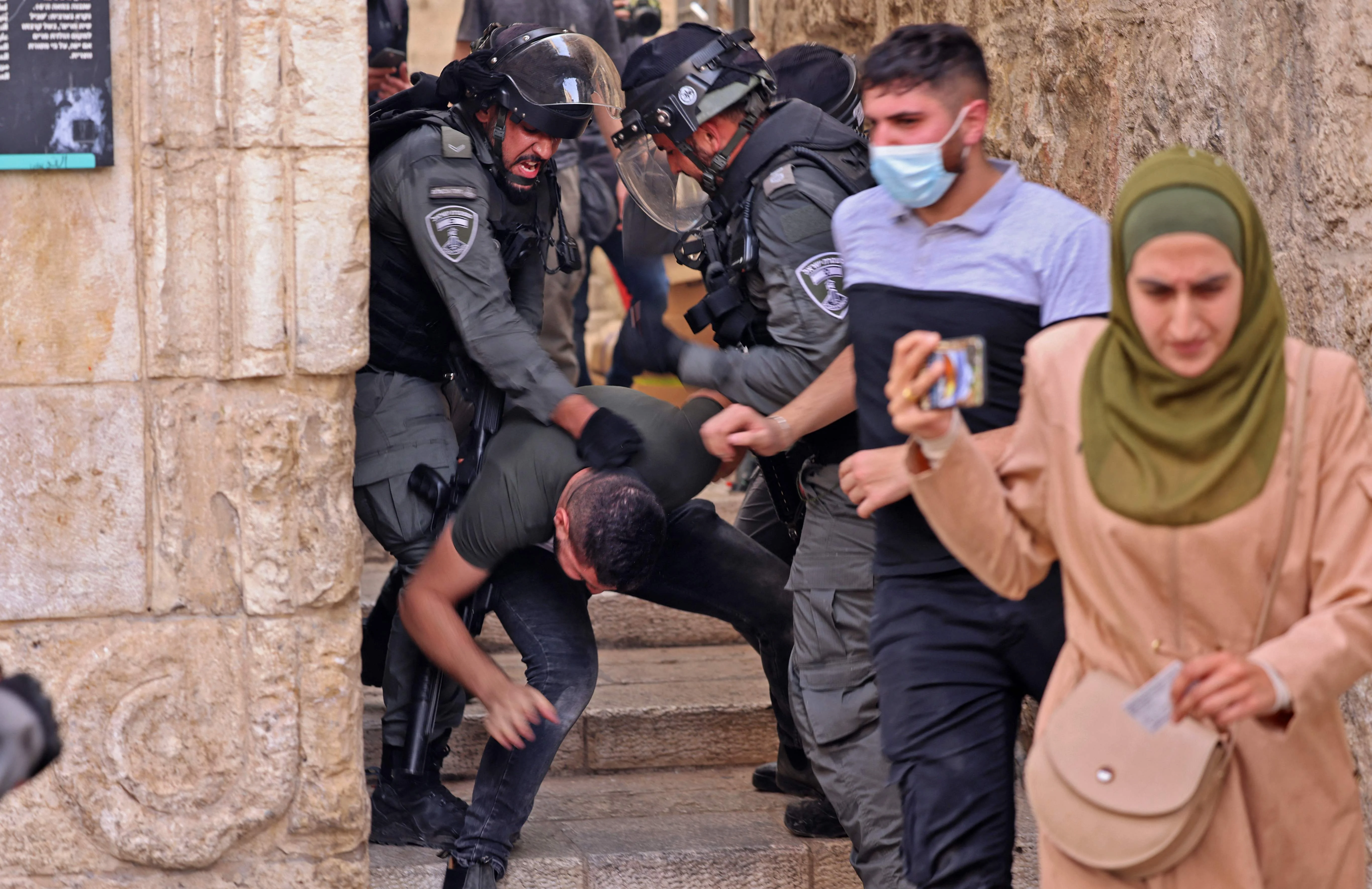Israeli security forces detain a Palestinian protester amid clashes in Jerusalems Old City on May 10, 2021, ahead of a planned march to commemorate Israels takeover of Jerusalem in the 1967 Six-Day War.