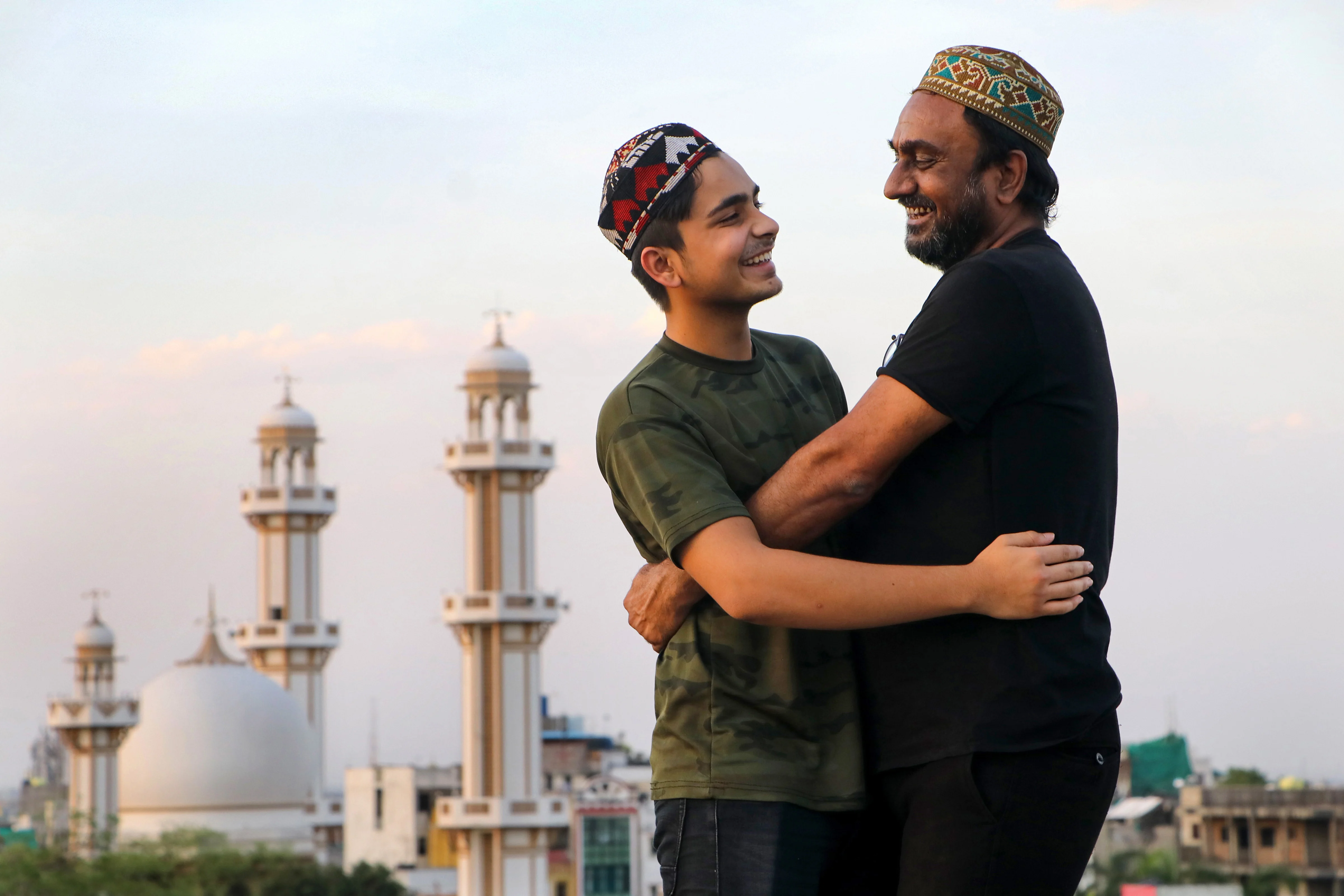 Nagpur: Muslim devotees greet each other on the occassion of Eid ul-Fitr, near Jama Masjid in Nagpur, FrIday, May 14, 2021.