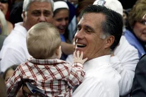 Republican presidential candidate and formerMassachusetts Gov. Mitt Romney picks up a baby as he campaigns in front of The Golden Lamb Inn and Restaurant in Lebanon, Ohio on Saturday.