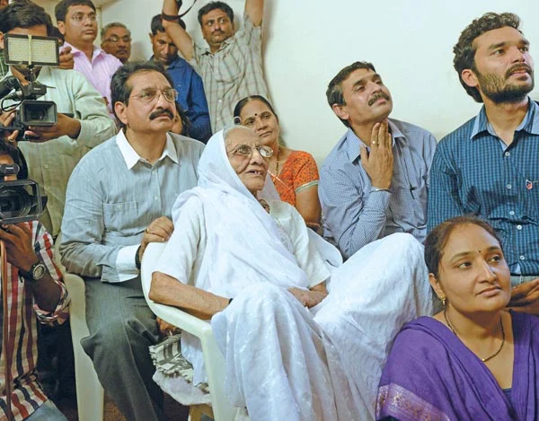 NOTHING LIKE HOME: Hiraba , Narendra Modi’s mother, riveted to the TV screen at her home in Gandhinagar.
