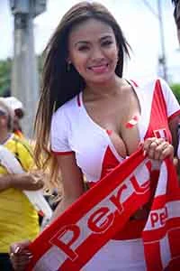 Fans of Peru cheer for their team before the start of the Russia 2018 FIFA World Cup qualifiers match Colombia vs Peru, outside the Metropolitano Roberto Melendez stadium in Barranquilla, Colombia, on October 8, 2015. AFP PHOTO / RAUL ARBOLEDA