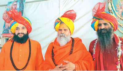 Sadhus of Niranjani Akhara pack bag from Simhastha Mela