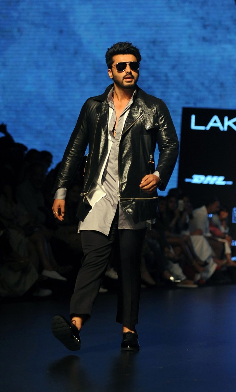 Indian Bollywood actor Arjun Kapoor displays a creation by designer Shahil Aneja during the Lakme Fashion Week (LFW) Winter/Festive 2016.