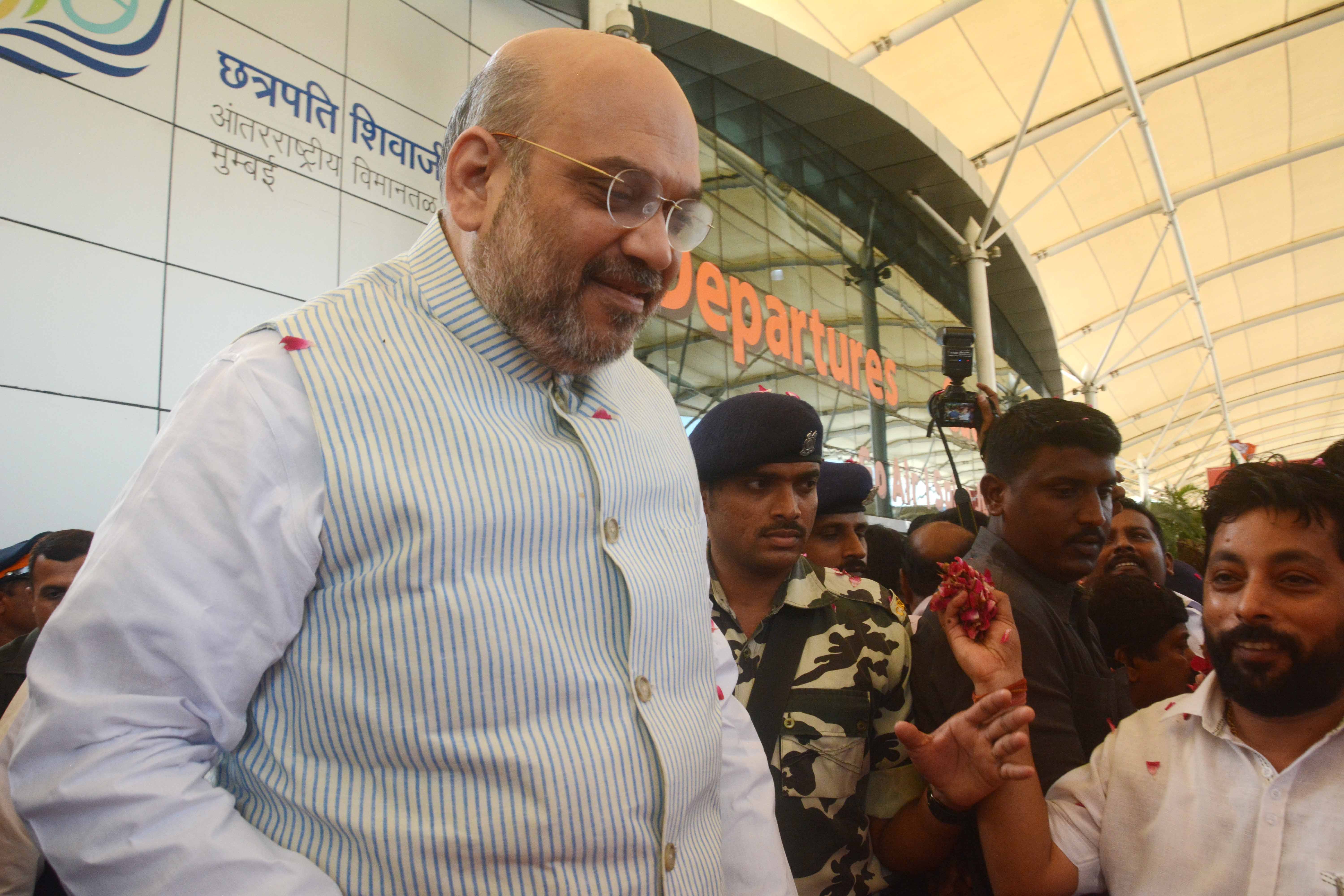 Mumbai: Bharatiya Janata Party (BJP) National President Amit Shah arrival in Mumbai party workers warm Welcome at Domestic airport Mumbai. Photo by BL SONI