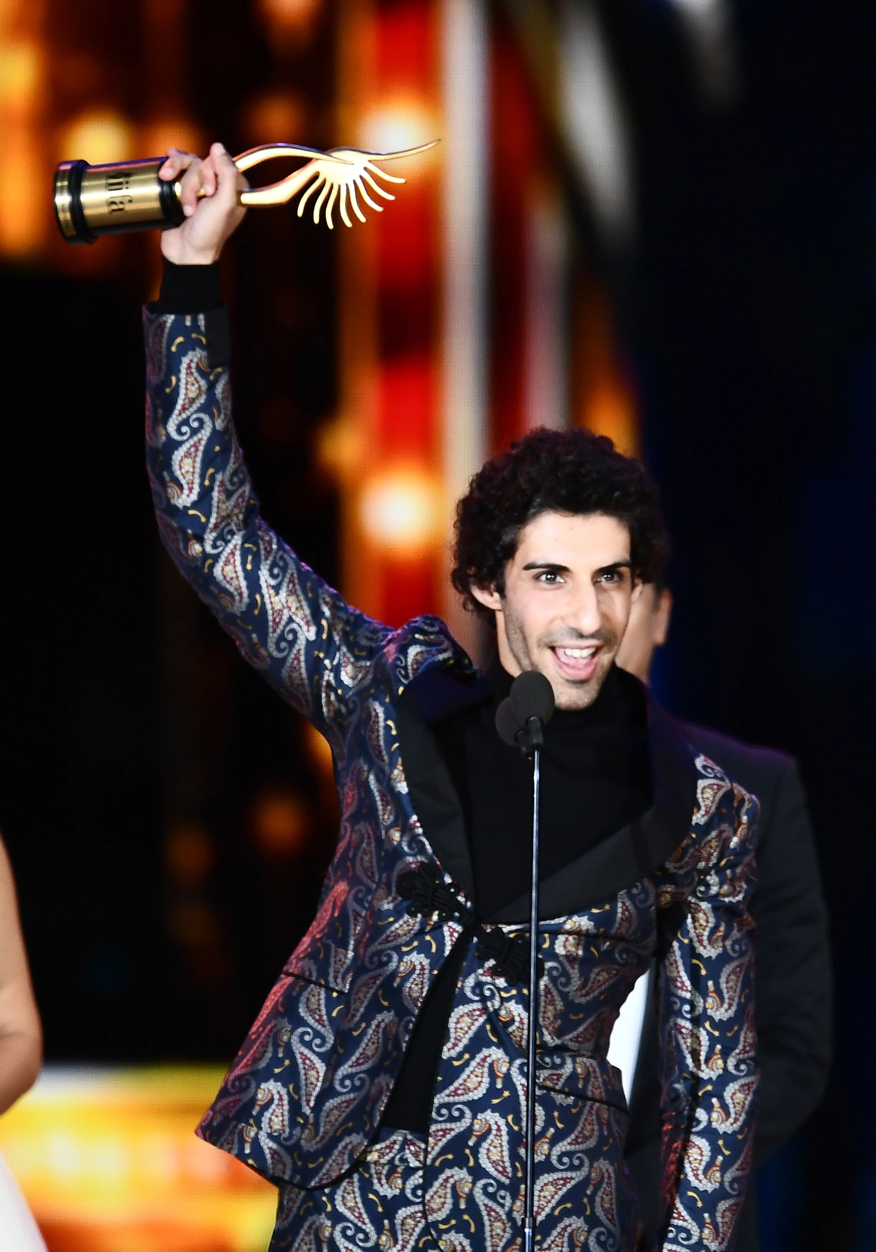 Winner of Performance in a Negative Role, Jim Sarbh for “Neerja” accepts the award during the 18th International Indian Film Academy (IIFA) Festival at the MetLife Stadium in East Rutherford, New Jersey, on July 15, 2017. / AFP PHOTO / JEWEL SAMAD