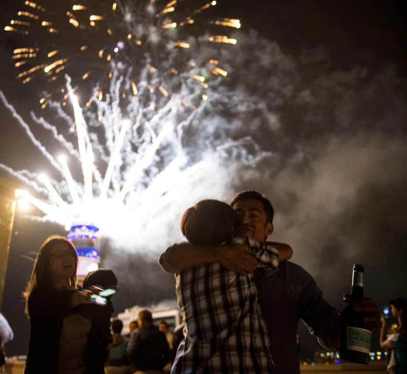 Fireworks illuminate the sky in Santiago during New Year’s celebrations on January 1, 2018. / AFP PHOTO / Martin BERNETTI