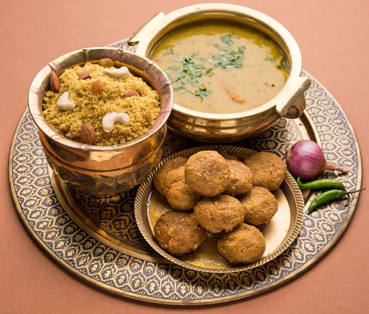 Baati and spicy dal with sweet churma