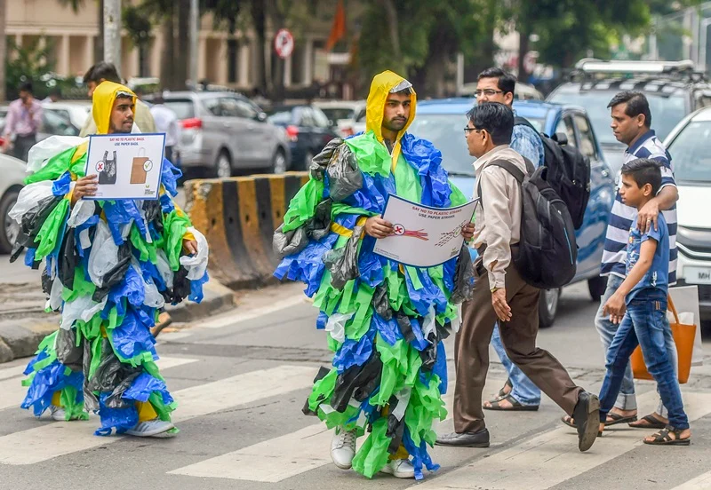 Mumbai: Volunteers, wearing costumes made up of plastic bags, aware people against the use of plastic bags, on the occasion of World Environment Day, in Mumbai on Tuesday, June 05, 2018. (PTI Photo/ Shashank Parade)(PTI6_5_2018_000053B)