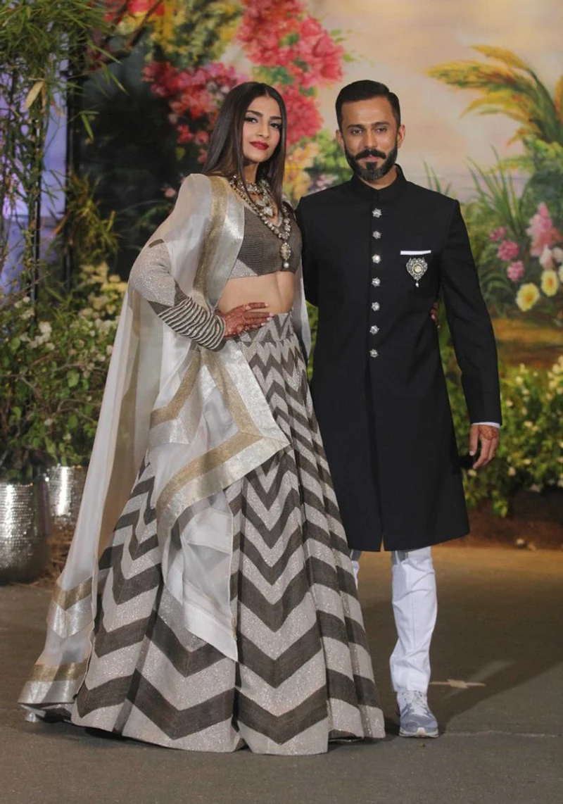 Mumbai : Actress Sonam Kapoor with husband Anand Ahuja during their Wedding<br />Reception at Leela Hotel in Mumbai on Tuesday night . Photo by BL SONI