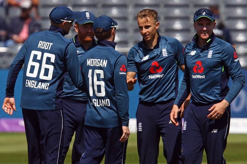 England's Tom Curran (2R) celebrates with team mates after taking the wicket of Pakistan's Haris Sohail (unseen) for 41 runs during the third One Day International (ODI) cricket match between England and Pakistan at The Bristol County Ground in Bristol on May 14, 2019. (Photo by GEOFF CADDICK / AFP) 