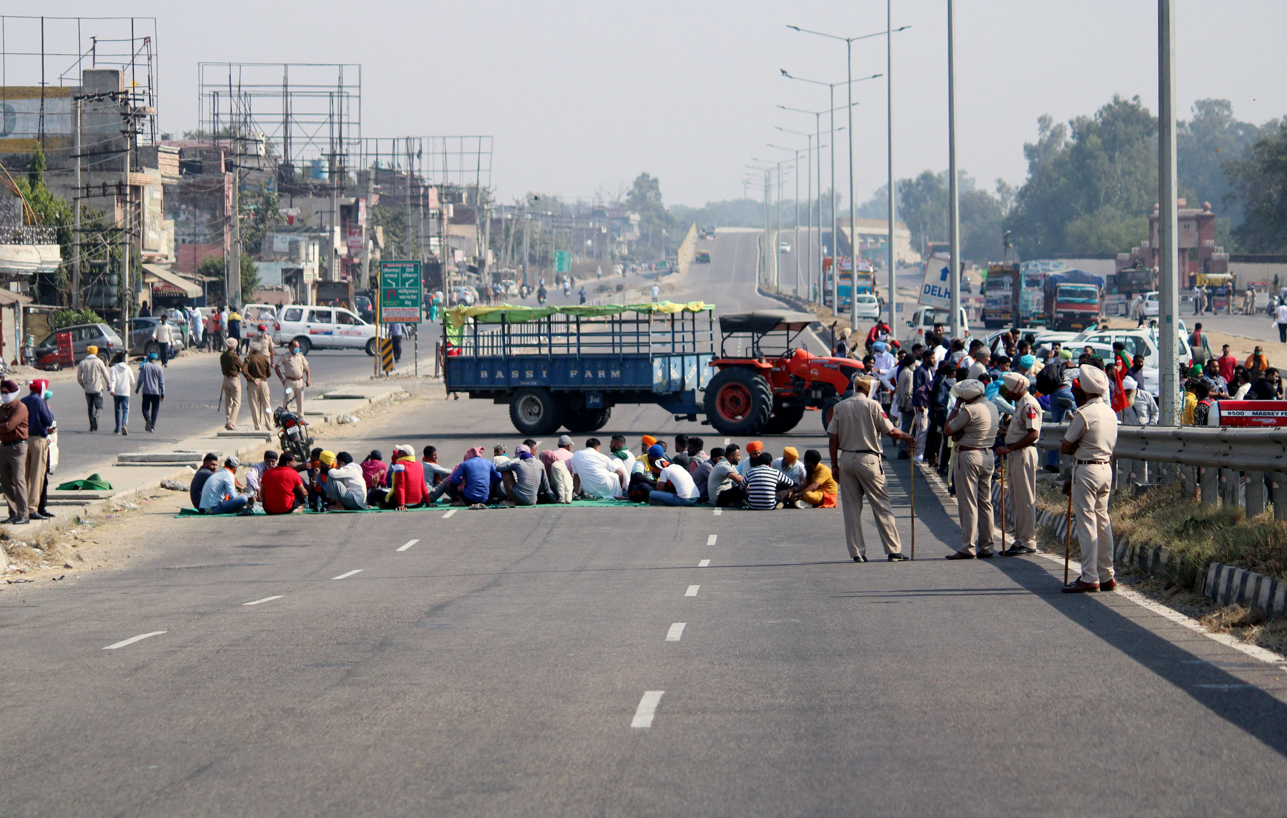 Farmers block Amritsar-Delhi National Highway during their four hours statewide Chakka Jam, near Jalandhar