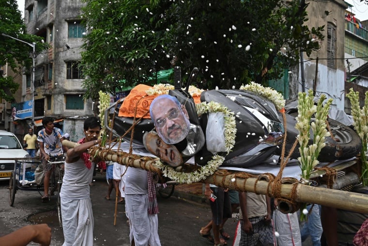 In Pics Activists in Kolkata stage mock funeral procession with masks