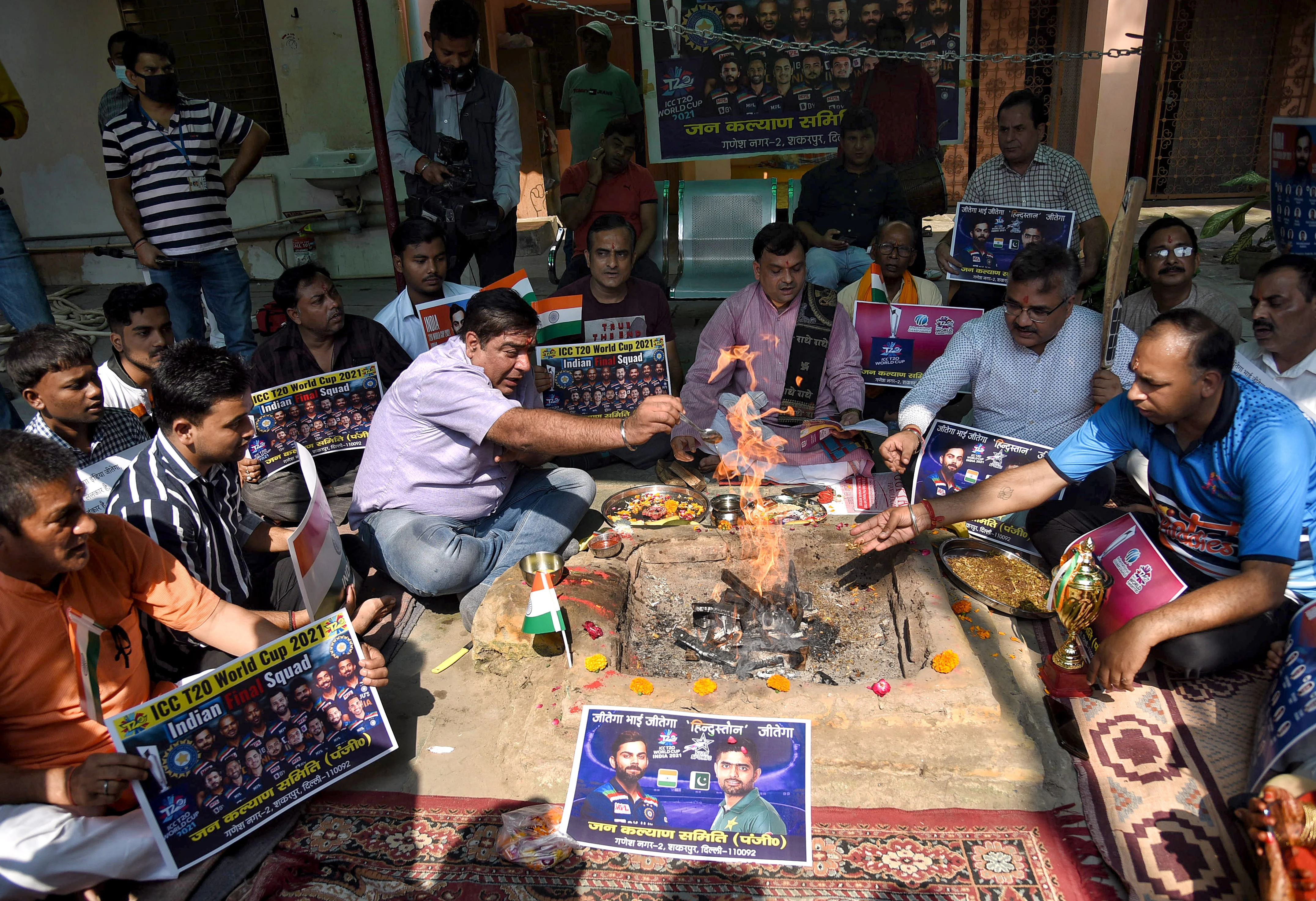 Cricket fans perform Hawan for the victory of the Indian team ahead of ICC Mens T20 World Cup 2021 match between India and Pakistan, in New Delhi on Sunday.