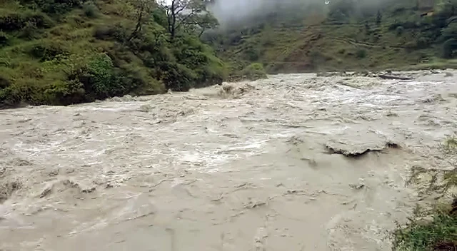 Uttarakhand, Oct 19 (ANI): Water level in the Nandakini river rises due to the continuous rainfall, in Chamoli on Tuesday. (ANI Photo)