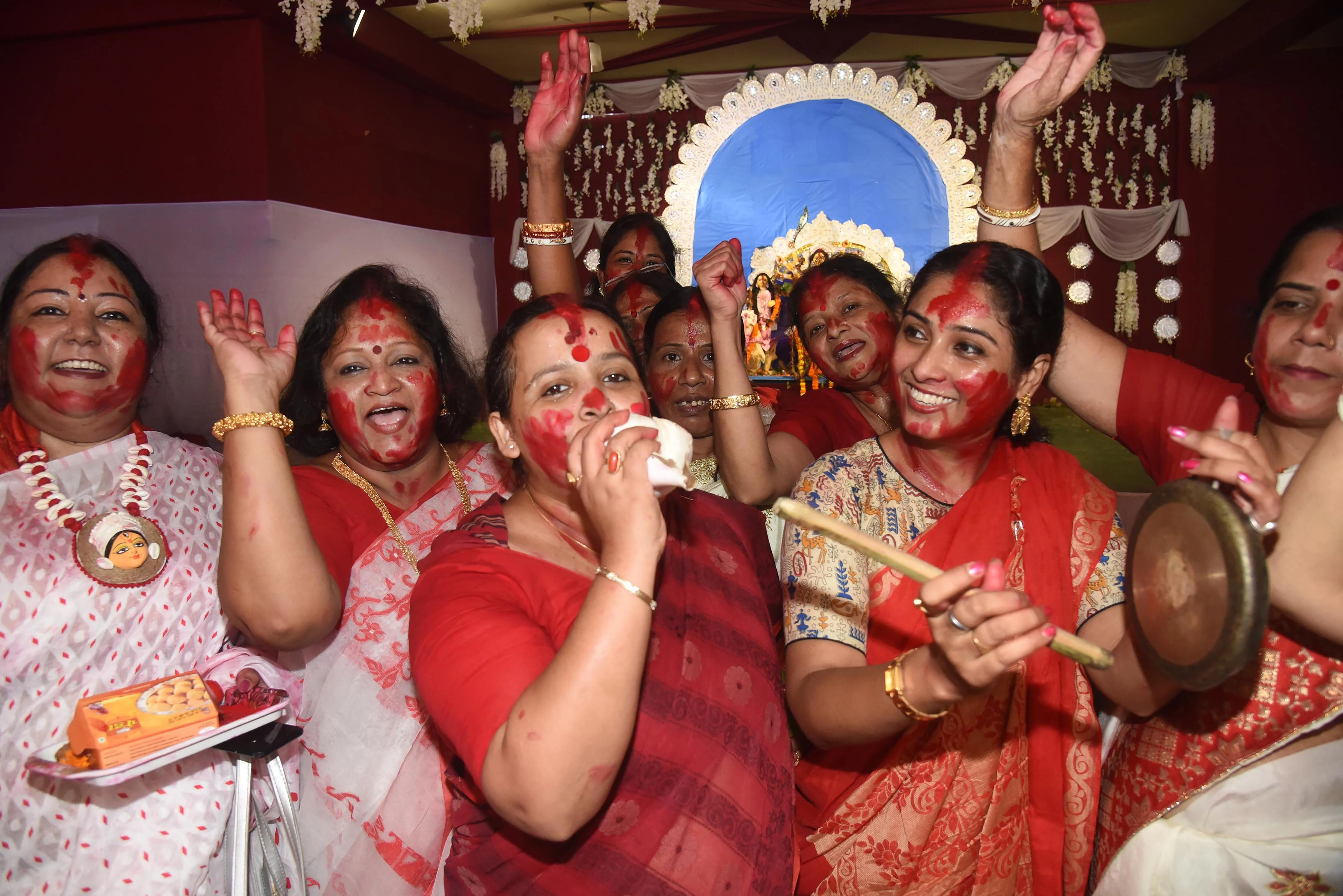 Women participate in Sindoor Khela at a puja pandal on the last day of Durga Puja celebrations in Patna, Friday, Oct. 15, 2021.