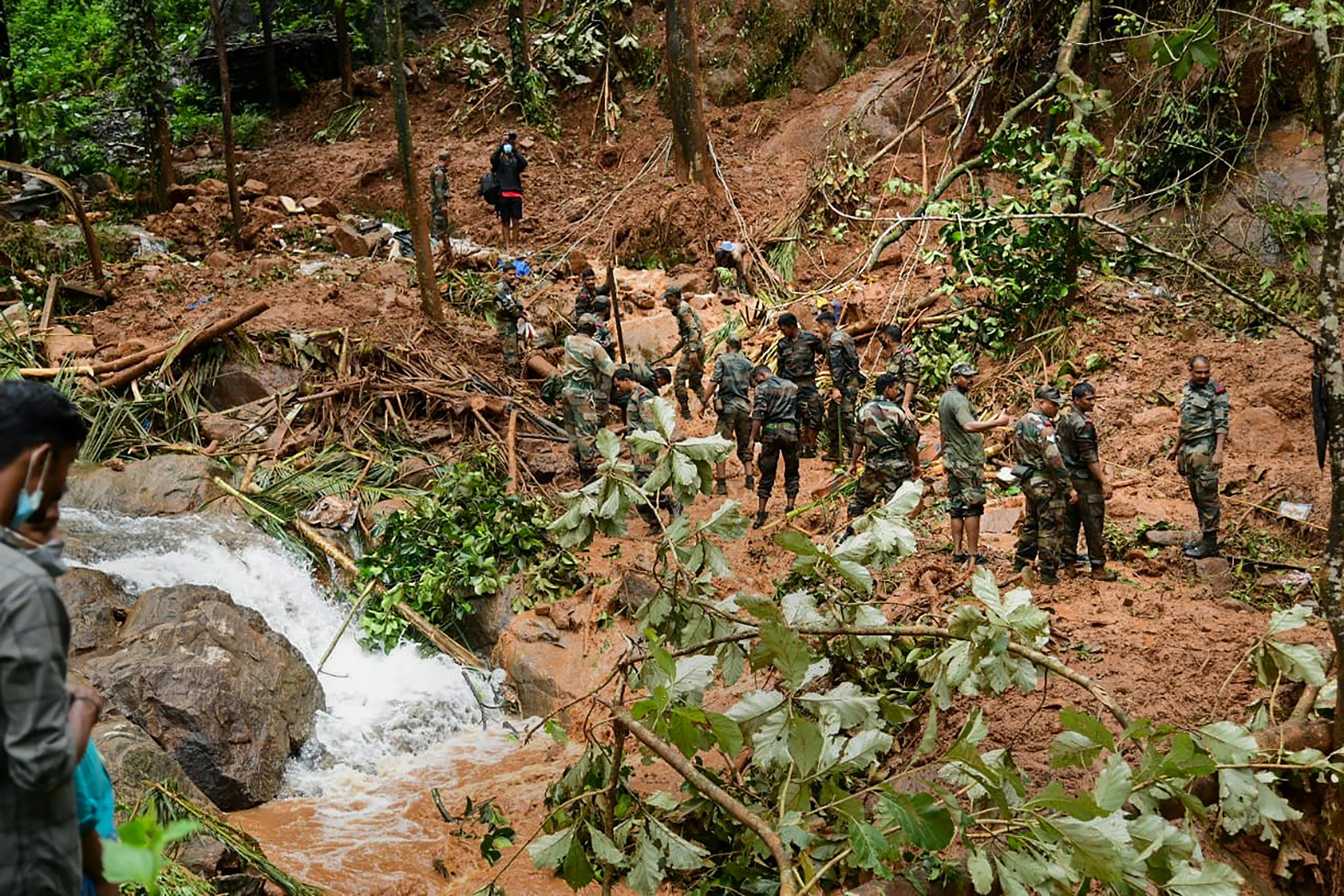 Kottayam: Rapid Action Force (RAF) and Kerala Fire and Rescue personnel during rescue operations at the site of landslide at Kavali in Kottayam district, Sunday,