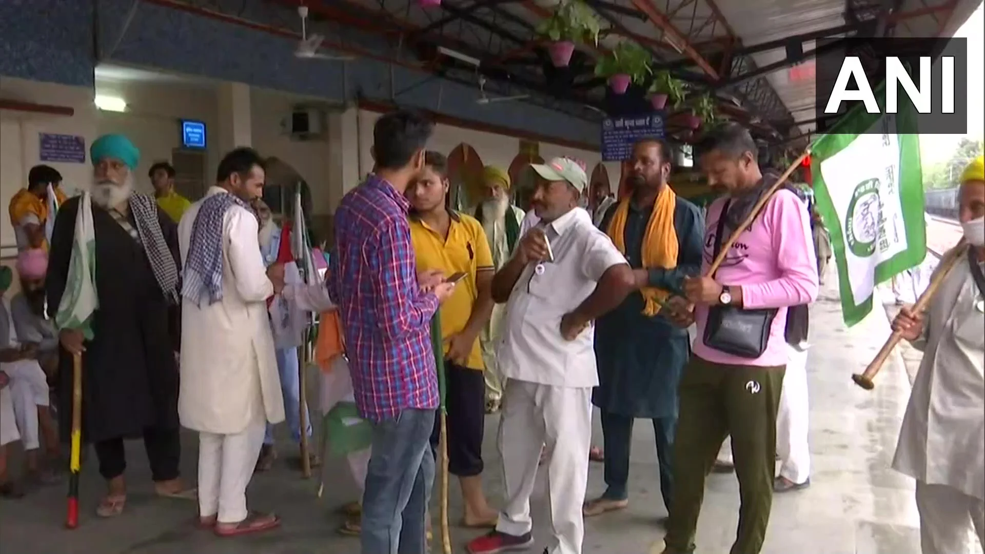 Protestors gather at Sonipat Railway Station, Haryana in the wake of 'Rail roko' call by Samyukta Kisan Morcha in protest against Lakhimpur Kheri incident.