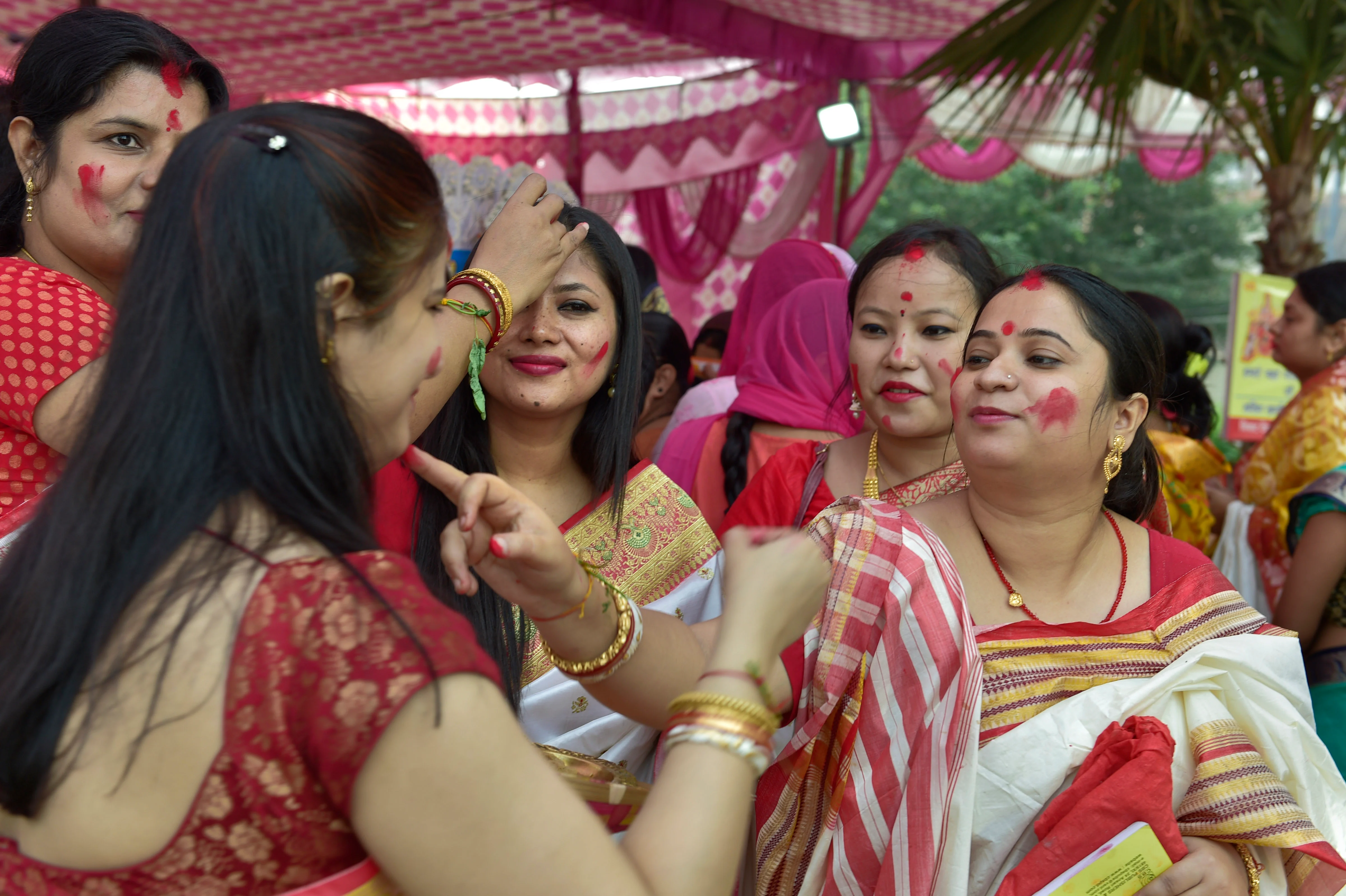 Married women play Sindoor Khela before the immersion of Goddess Durga on the last day of Durga Puja and Vijaya Dashami festival in Greater Noida, Friday, Oct 15, 2021.