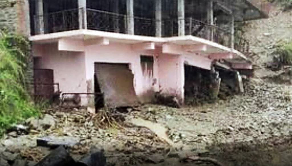 A house gets damaged due to the cloudburst, in Nainital on Tuesday