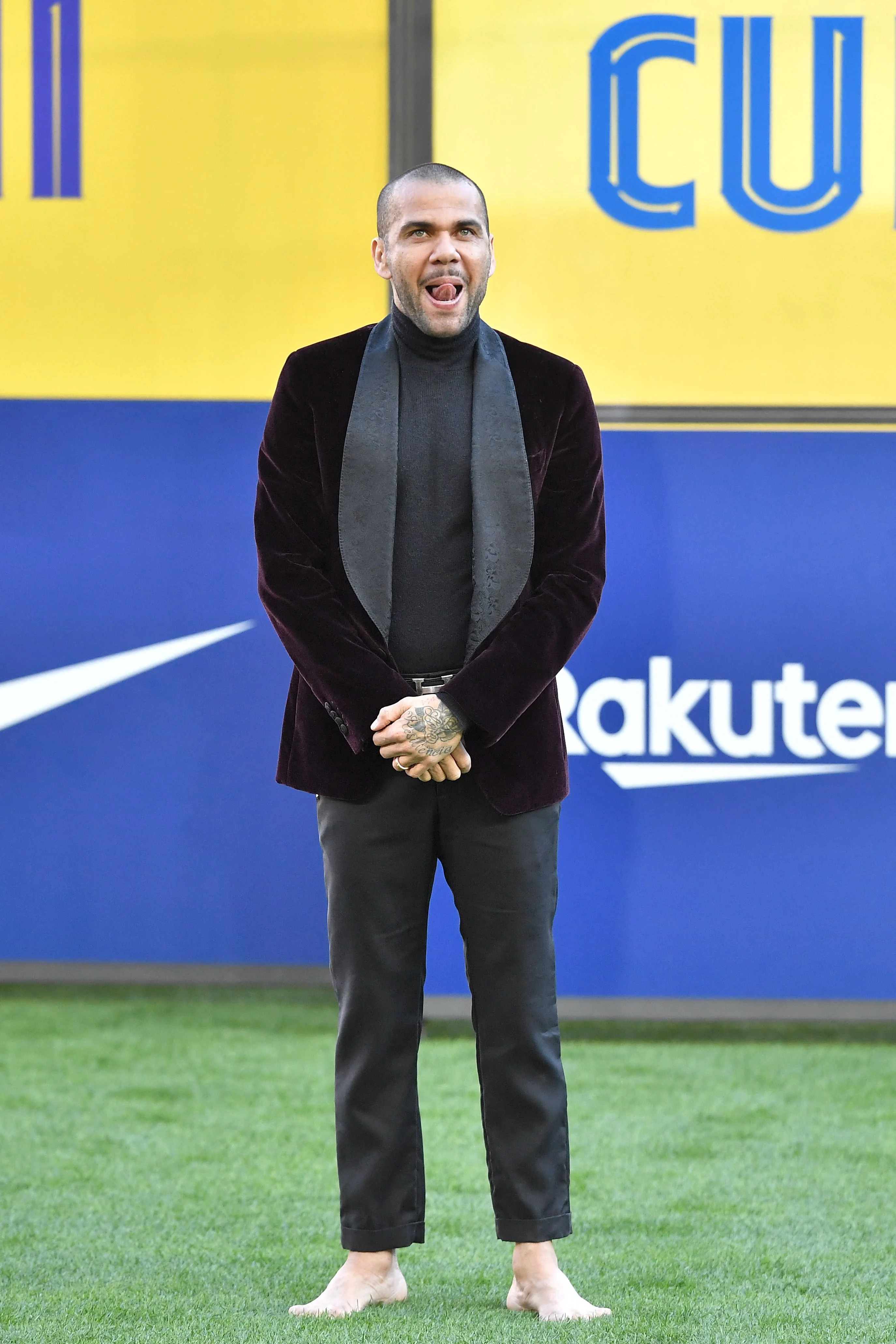 Dani Alves stepped barefoot onto the pitch