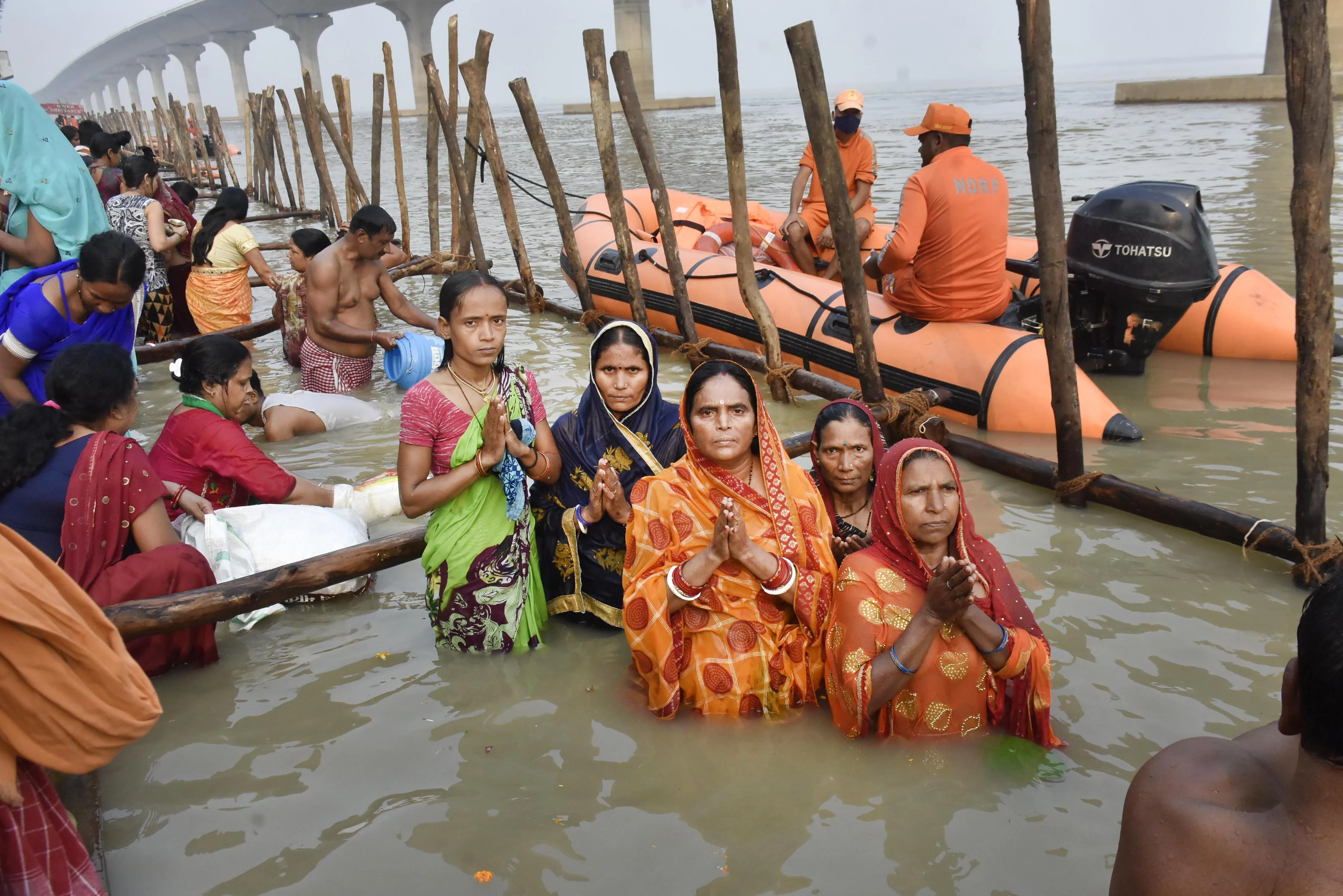 Hindu devotees offer prayers at the banks of River Ganga during the first day of four days long Chhath Puja celebration, in Patna, Monday, Nov. 8, 2021.