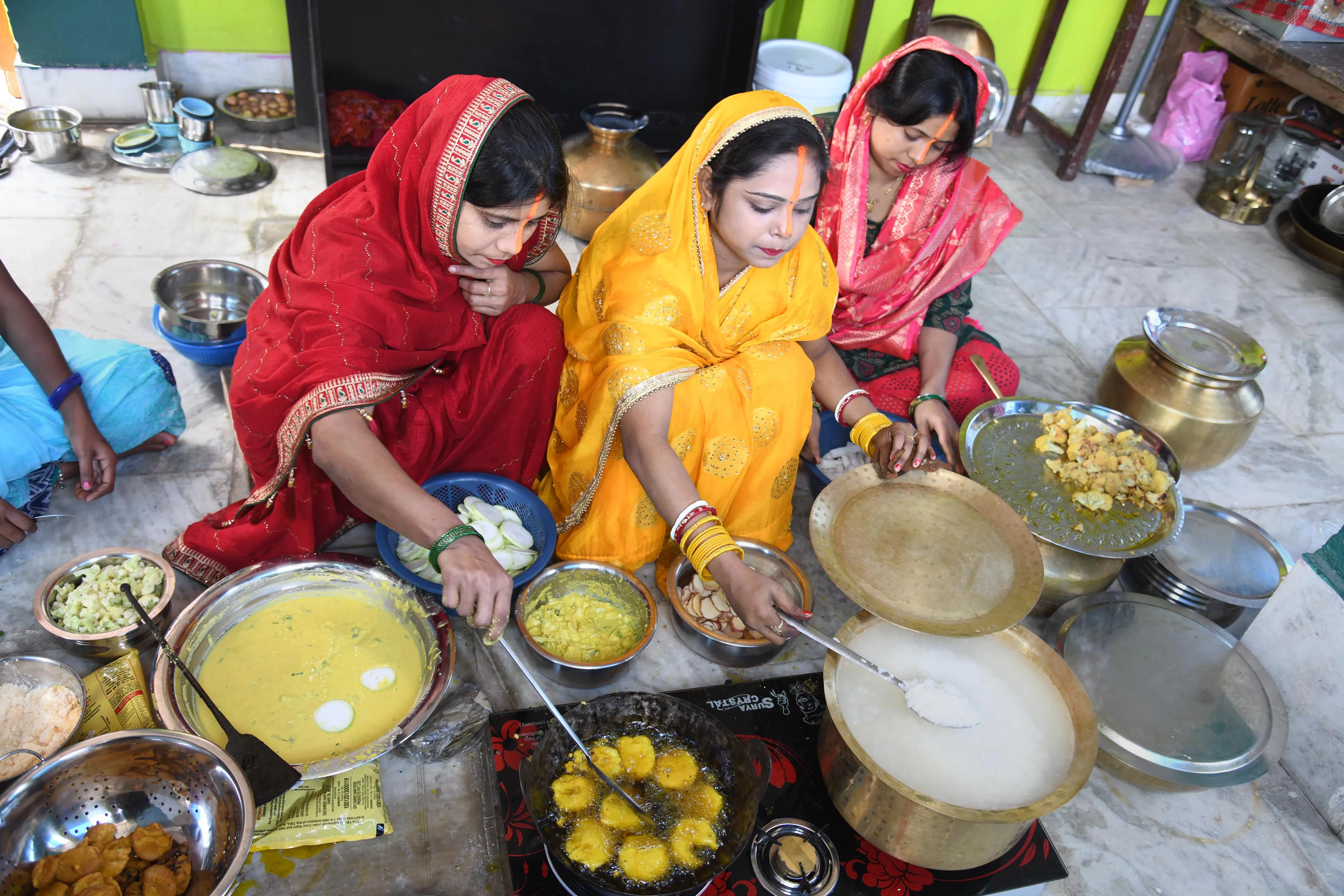 Devotees prepare holy food (Prasad) during the Nahaye Khaye on the occasion of the four days long Chhath Puja festival in Patna, Monday, Nov. 8, 2021.