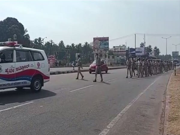 Karnataka hijab row: Police personnel, security forces hold flag march in Udupi ahead of school reopening - Vimarsana News