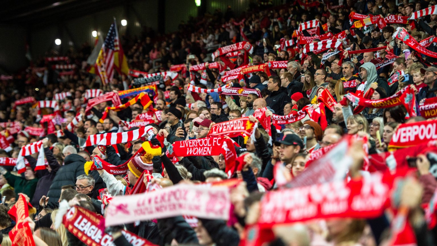 Liverpool fans raising their scarves at Anfield