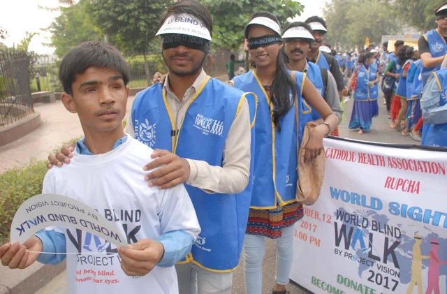 World Sight Day: Children walk blind-folded in New Delhi. World Sight Day: Children walk blind-folded in New Delhi.