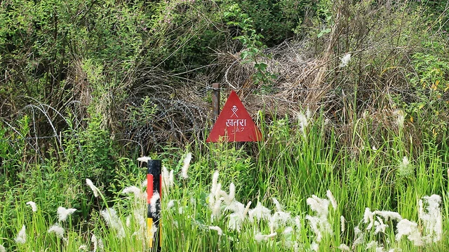 A landmine warning sign near a farm in a border village in Poonch. Not all minefields are duly marked A landmine warning sign near a farm in a border village in Poonch. Not all minefields are duly marked