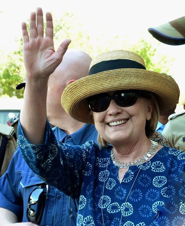 Former US Secretary of State Hillary Clinton waves as she arrives at Jodhpur Airport, in Jodhpur. Former US Secretary of State Hillary Clinton waves as she arrives at Jodhpur Airport, in Jodhpur.