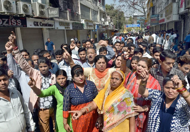 Traders of shops at Amar Colony protest against sealing drive in New Delhi. Traders of shops at Amar Colony protest against sealing drive in New Delhi.
