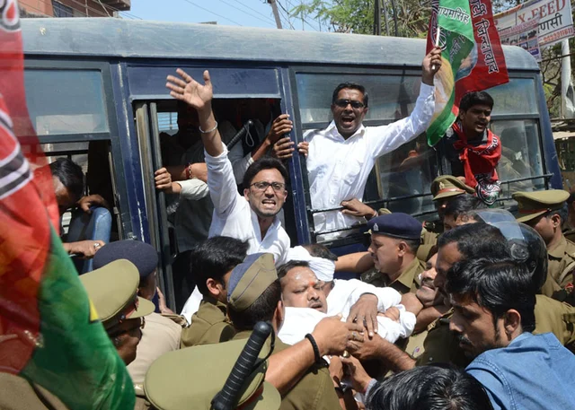 Police take away SP workers during their protest, in Varanasi. Police take away SP workers during their protest, in Varanasi.