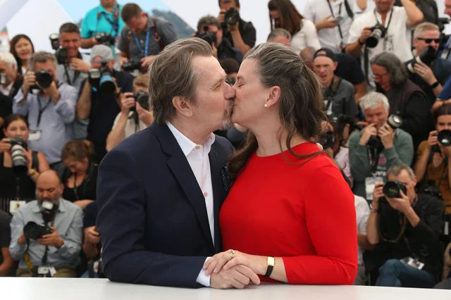 Actor Gary Oldman, left, kisses his wife Gisele Schmidt during a photo call at the 71st international film festival, Cannes, southern France. Actor Gary Oldman, left, kisses his wife Gisele Schmidt during a photo call at the 71st international film festival, Cannes, southern France.