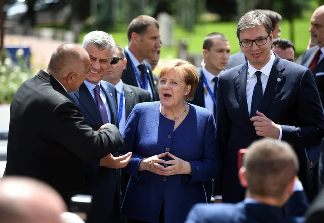 German Chancellor Angela Merkel, centre , speaks with Serbia President Aleksander Vusic, right, Kosovo’s President Hashim Thaci, second left, and Bulgarian Prime Minister Boyko Borissov, left, during a group photo at an EU and Western Balkan heads of state summit at the National Palace of Culture in Sofia, Bulgaria German Chancellor Angela Merkel, centre , speaks with Serbia President Aleksander Vusic, right, Kosovo’s President Hashim Thaci, second left, and Bulgarian Prime Minister Boyko Borissov, left, during a group photo at an EU and Western Balkan heads of state summit at the National Palace of Culture in Sofia, Bulgaria