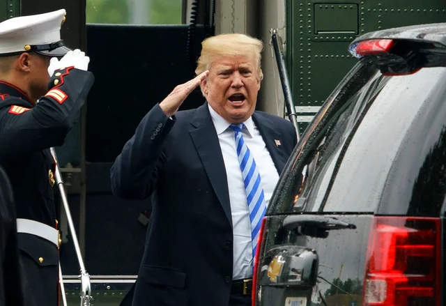 President Donald Trump salutes as he arrives on Marine One at Walter Reed National Military Medical Centre, Bethesda. The White House says Melania Trump is hospitalised after undergoing a procedure to treat a benign kidney condition. President Donald Trump salutes as he arrives on Marine One at Walter Reed National Military Medical Centre, Bethesda. The White House says Melania Trump is hospitalised after undergoing a procedure to treat a benign kidney condition. 