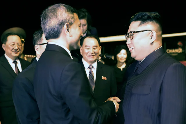 North Korean leader Kim Jong Un is greeted before his departure, at Changi airport, following the summit with US President Donald Trump. North Korean leader Kim Jong Un is greeted before his departure, at Changi airport, following the summit with US President Donald Trump.