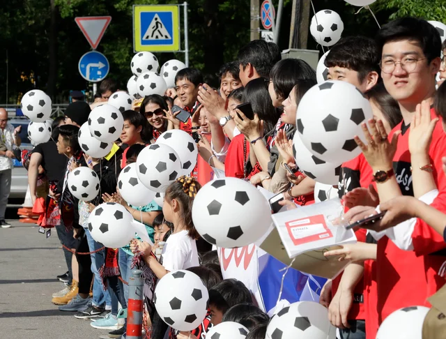 South Korean soccer fans hold soccer ball-shaped balloons upon South Korea’s national soccer team’s arrival at the team hotel for the 2018 soccer World Cup in St Petersburg, Russia. South Korean soccer fans hold soccer ball-shaped balloons upon South Korea’s national soccer team’s arrival at the team hotel for the 2018 soccer World Cup in St Petersburg, Russia.
