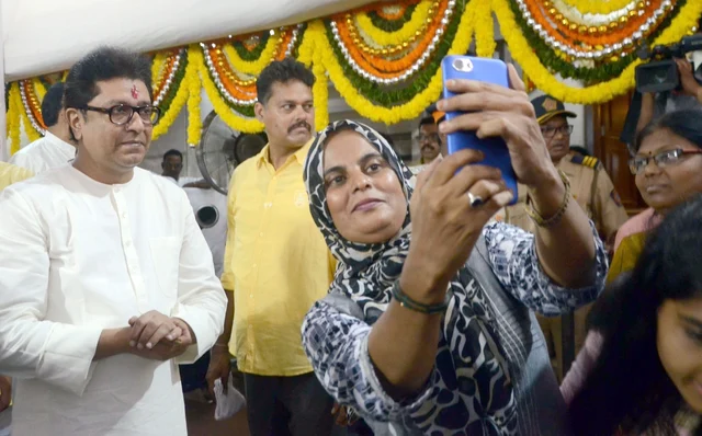 A party worker clicks a selfie with Maharashtra Navnirman Sena (MNS) President Raj Thackeray during his birthday celebrations at his residence in Dadar, Mumbai. A party worker clicks a selfie with Maharashtra Navnirman Sena (MNS) President Raj Thackeray during his birthday celebrations at his residence in Dadar, Mumbai.
